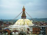 2 1 Boudhanath From Nearby Rooftop Our only organized tour in Kathmandu was to Boudhanath, the largest stupa in Nepal and estimated to be about 1400 years old. To get a better view, I walked through the side streets to a hotel on a small ridge. I politely asked if I could go to the roof for some photos and they pleasantly obliged. I sat there for a while just soaking in this wonderful scene; the size of Boudhanath struck me even more so from this higher farther vantage point.